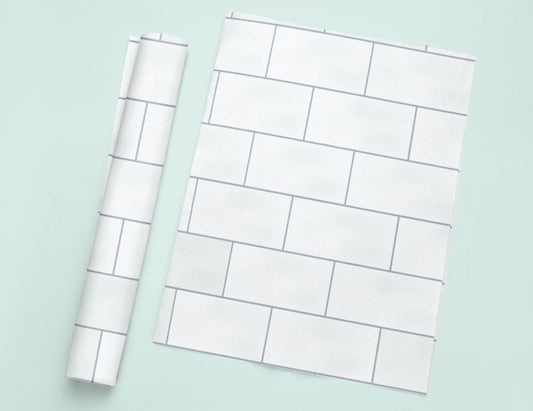 a piece of white paper next to a roll of white paper