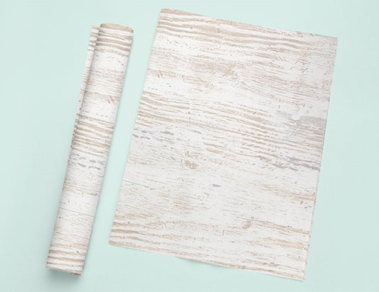 a piece of wood next to a roll of paper