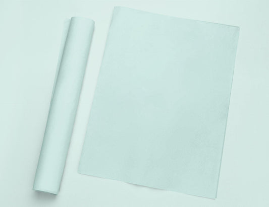 a roll of white paper next to a roll of white paper