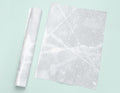 a piece of white marble next to a roll of paper