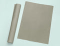 a roll of brown paper next to a roll of brown paper