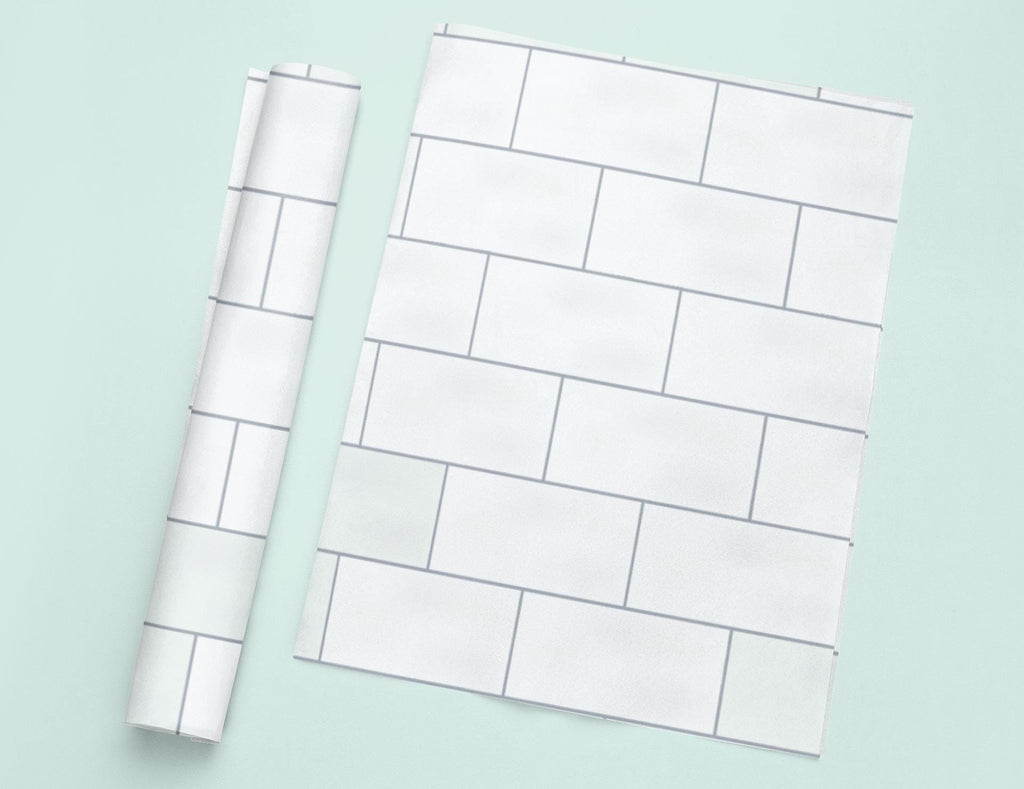 a piece of white paper next to a roll of white paper