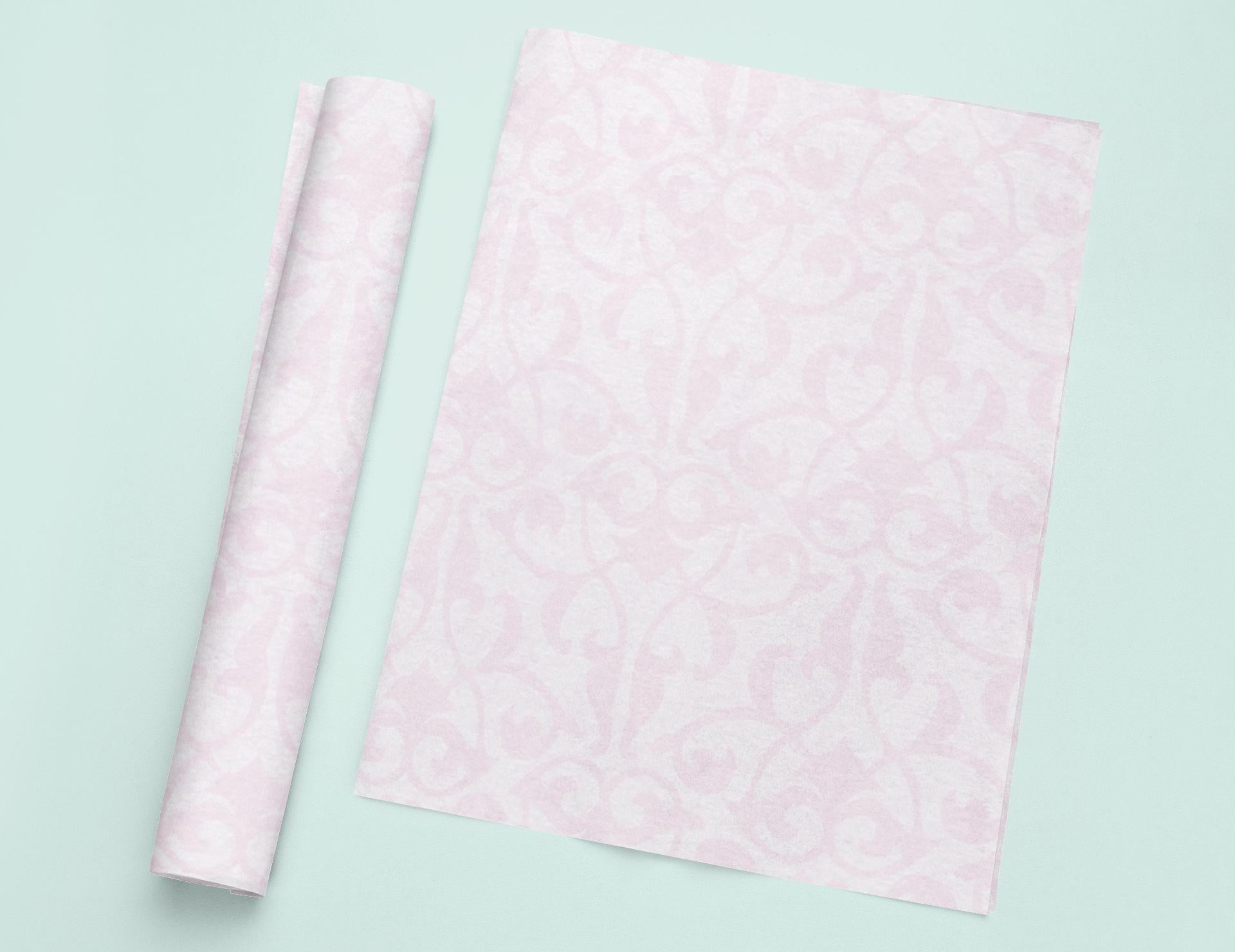 a roll of pink tissue next to a roll of pink tissue