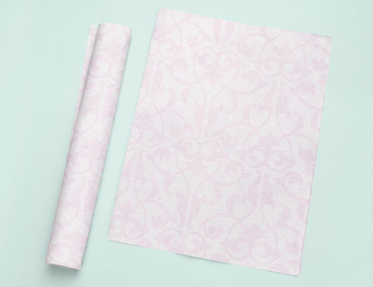 a roll of pink tissue next to a roll of pink tissue