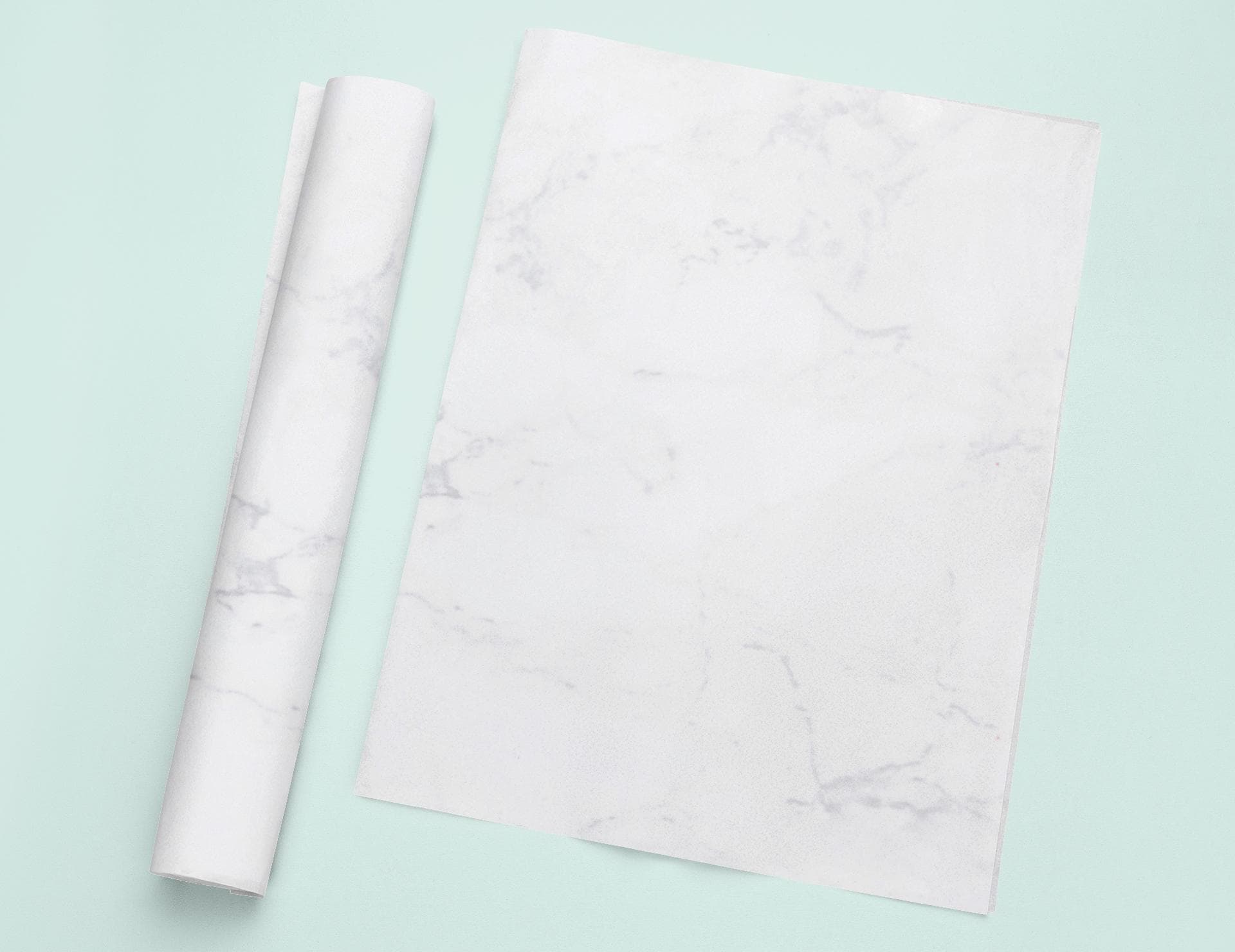 a roll of white paper next to a roll of white paper
