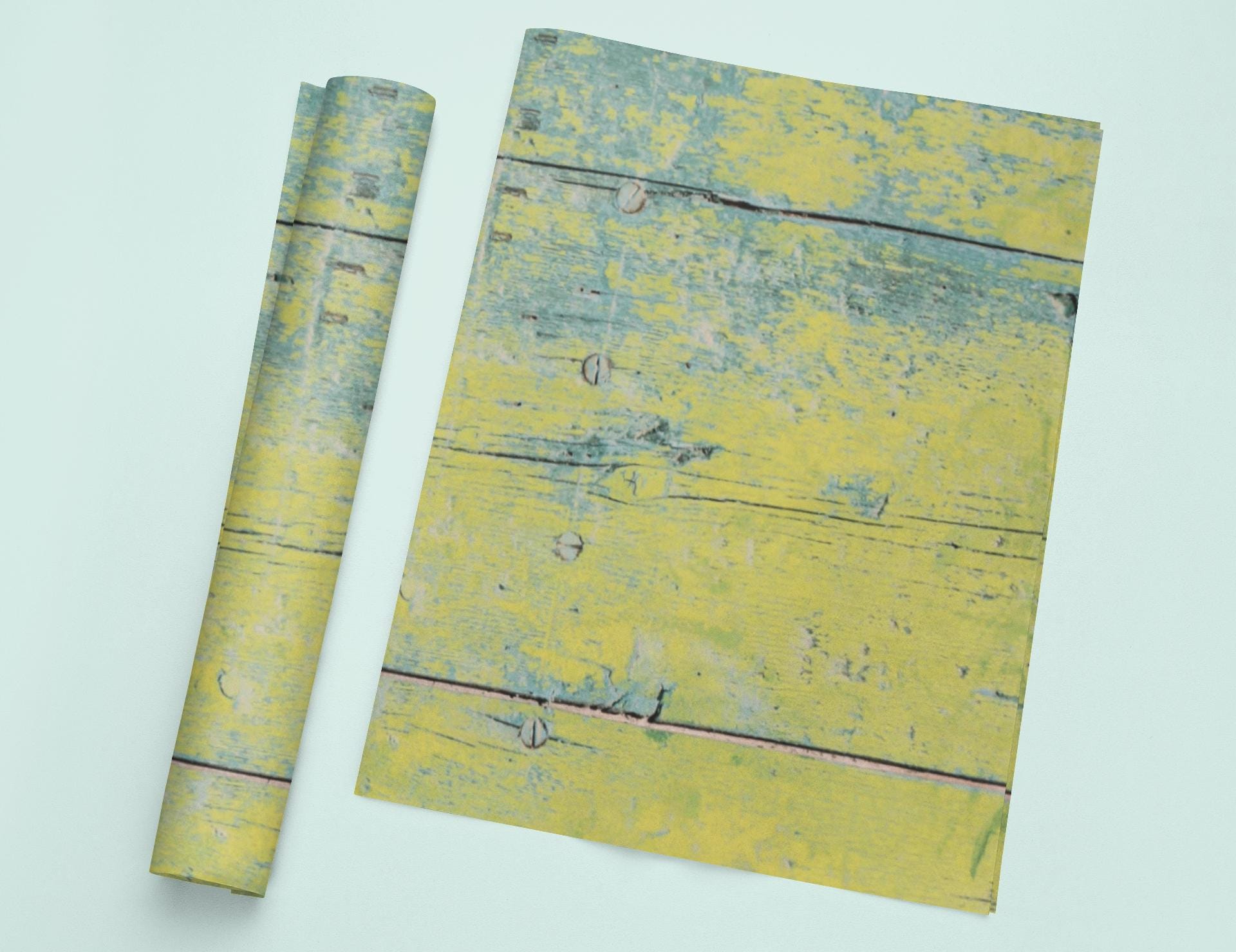 a yellow piece of paper with a piece of wood sticking out of it