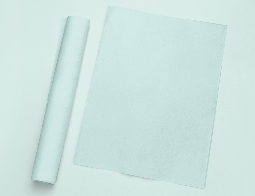 a roll of white paper next to a roll of white paper